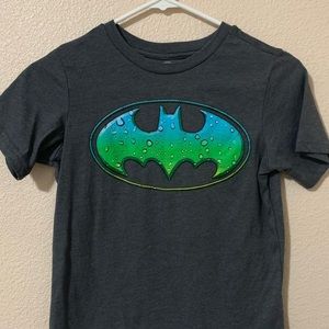Dark grey boys shirt with Batman symbol. Size: Medium (8)